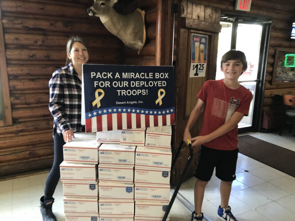 It's great to see our kids get involved in packing boxes for those deployed away from home.