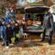 A headless man hands out candy at the OCSC Trunk or Treat Event